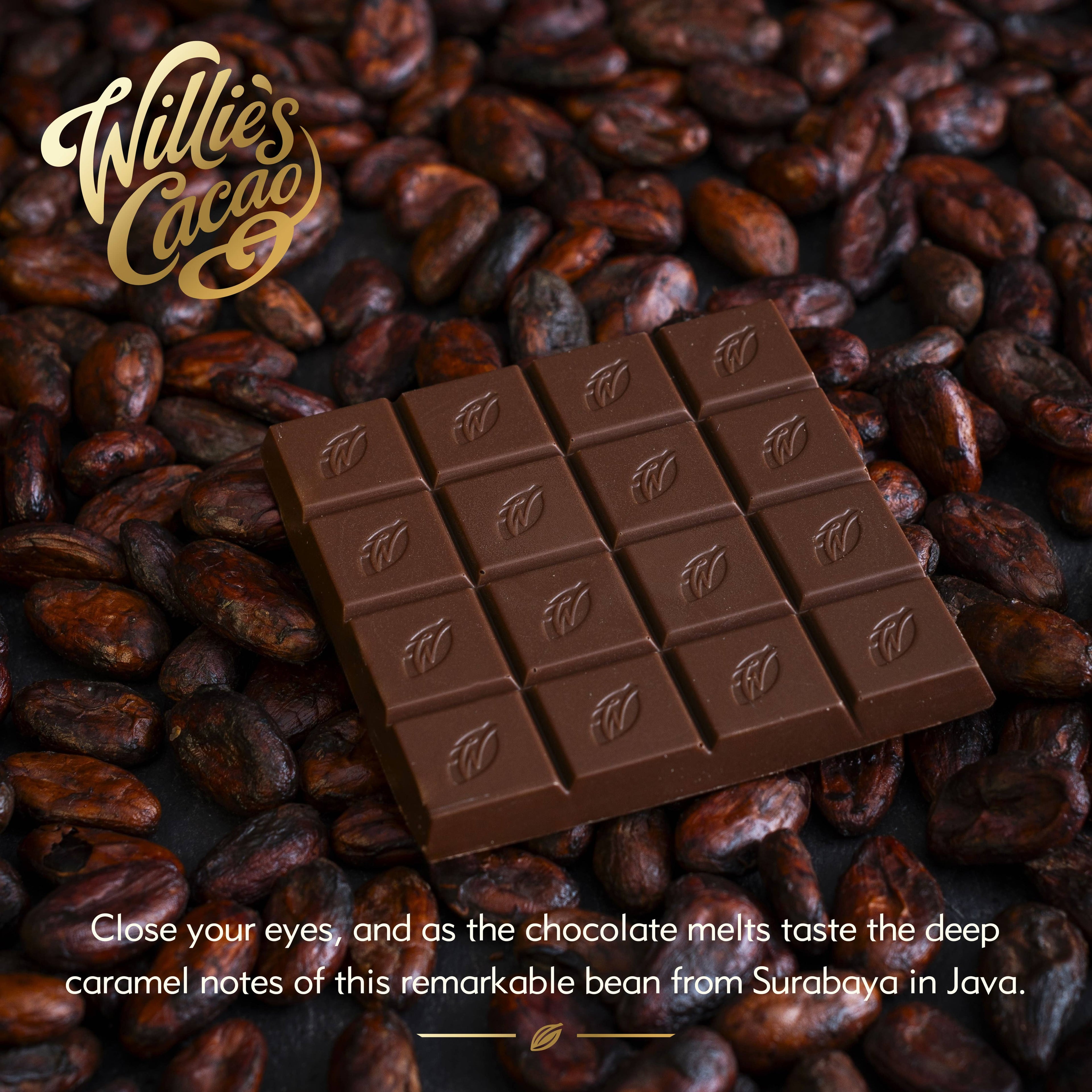 Willie's Cacao 54% Milk of the Stars Milk Chocolate bar unwrapped on cacao beans, single-origin Surabaya Indonesia, SOFI Award winner