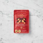 Cacao Adventures Ceremonial Grade Cacao Paste red pouch front on marble background, 227g / 8oz, High Amazon Basin Amazonas Peru, sugar-free vegan keto-friendly