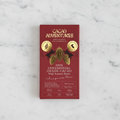 Cacao Adventures 100% Ceremonial Grade Cacao Bar red box on white marble surface, single-origin High Amazon Peru, vegan sugar-free keto-friendly, 50g