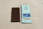 French Broad Chocolate 45% Malted Milk Chocolate bar and packaging on light linen surface
