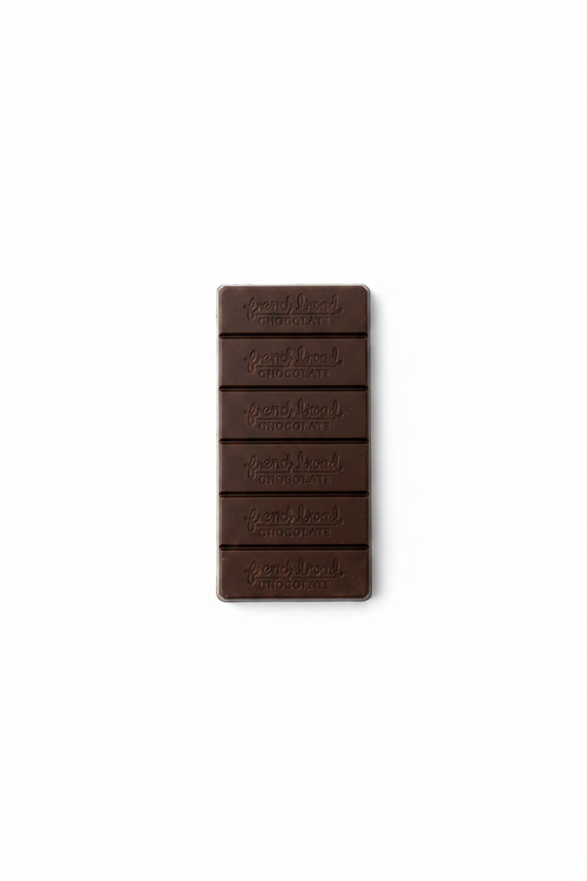 French Broad Chocolate 45% Malted Milk Chocolate bar unwrapped showing embossed French Broad Chocolate branding on white background