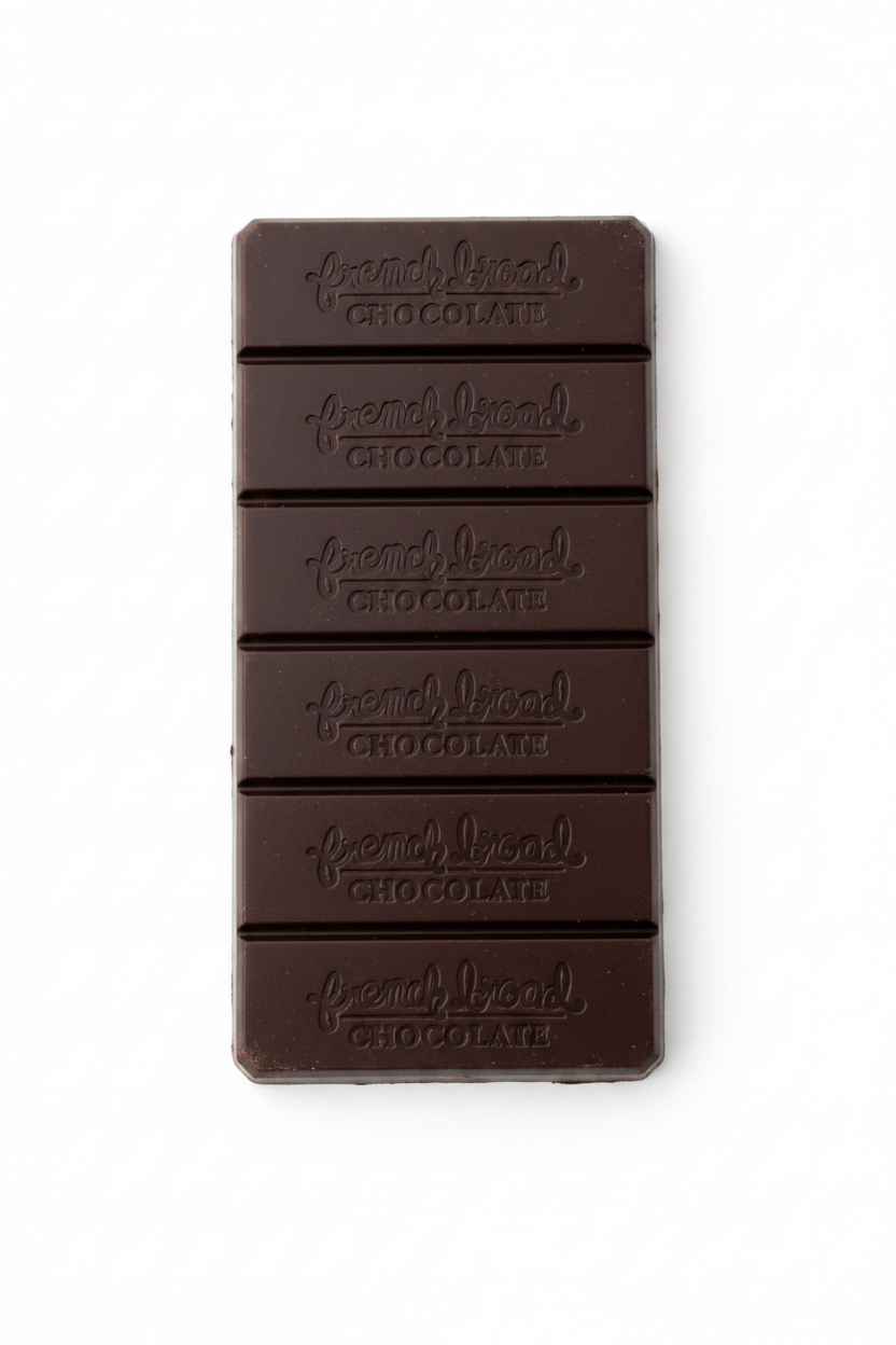French Broad Chocolate 70% Uganda Dark Chocolate bar on white background showing embossed French Broad Chocolate branding
