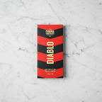 I Love Panama Chocolate Diablo 70% dark chocolate bar with chili peppers, front view, on a white marble background