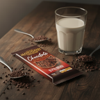 Mahogany dark milk chocolate bar with cacao nibs and a glass of milk