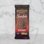 Mahogany 57% dark milk chocolate with cacao nibs bar on white marble