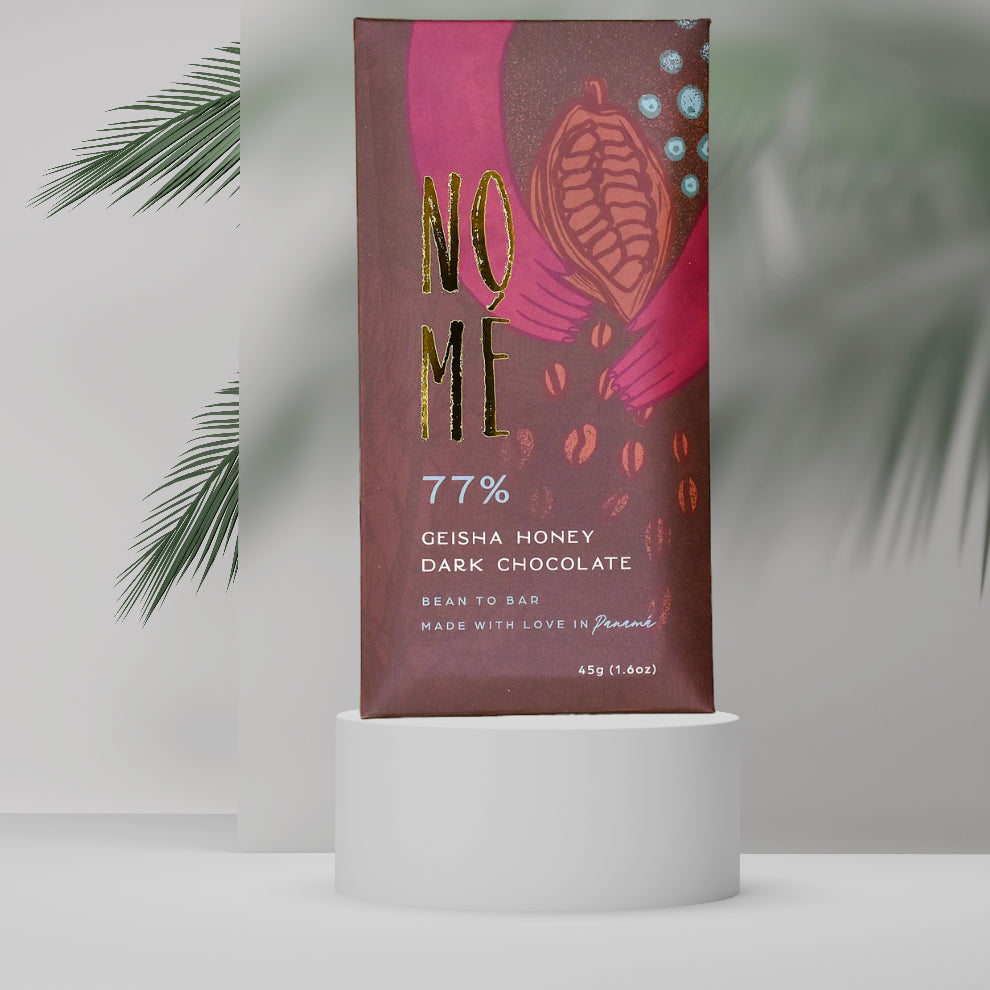 Dark chocolate bar packaging with 'NOME' branding on a white pedestal against a light gray background.