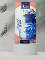Nomé 93% Chocolate Oscuro bar with Sea Salt and Cacao Nibs packaging, salmon pink with blue botanical watercolor illustration, single-origin Panamanian chocolate, vegan