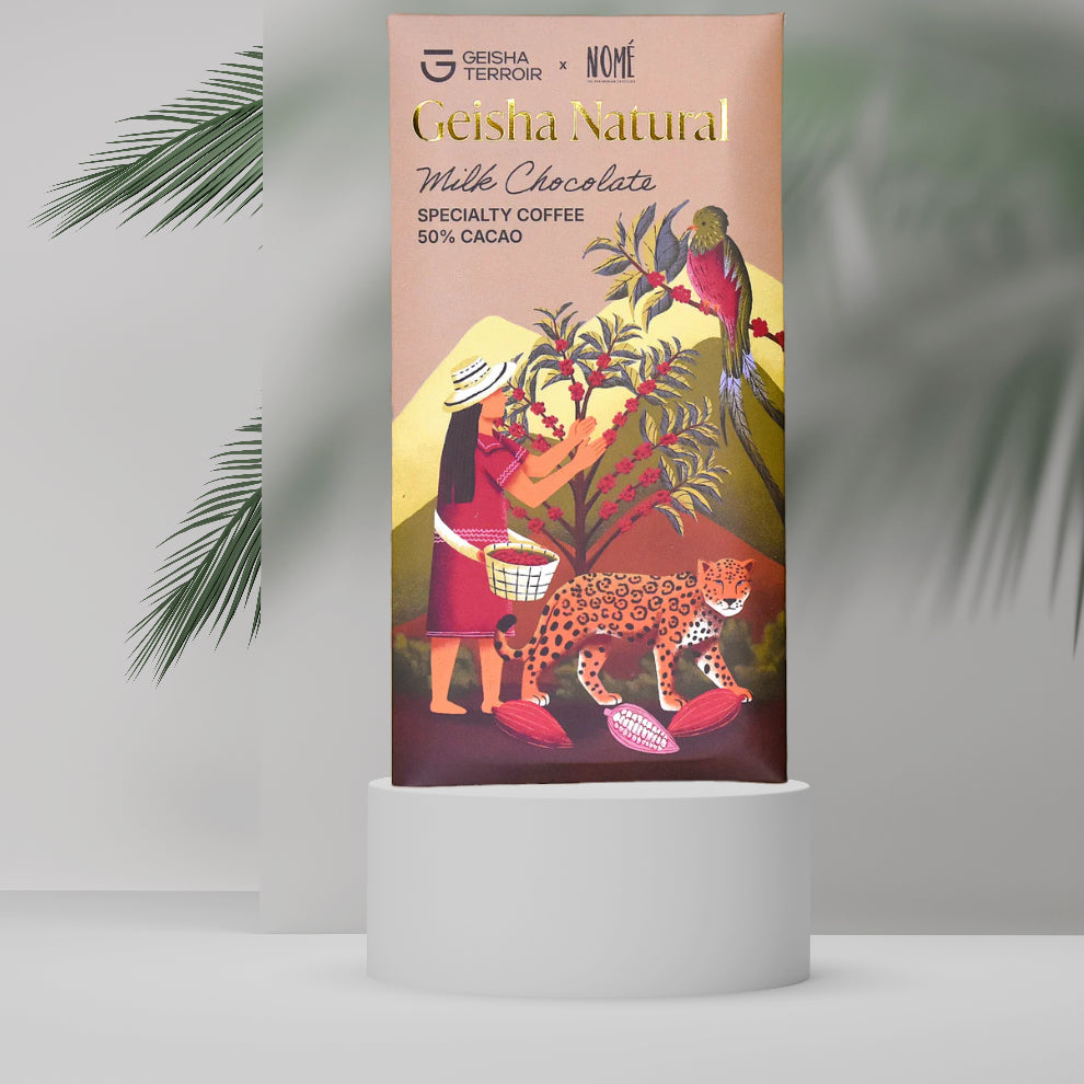 Geisha Terroir x Nomé 50% Geisha Natural Milk Chocolate bar packaging with blush rose-gold background and illustrated coffee picker, jaguar, and quetzal bird on white background, single-origin Panama, 45g