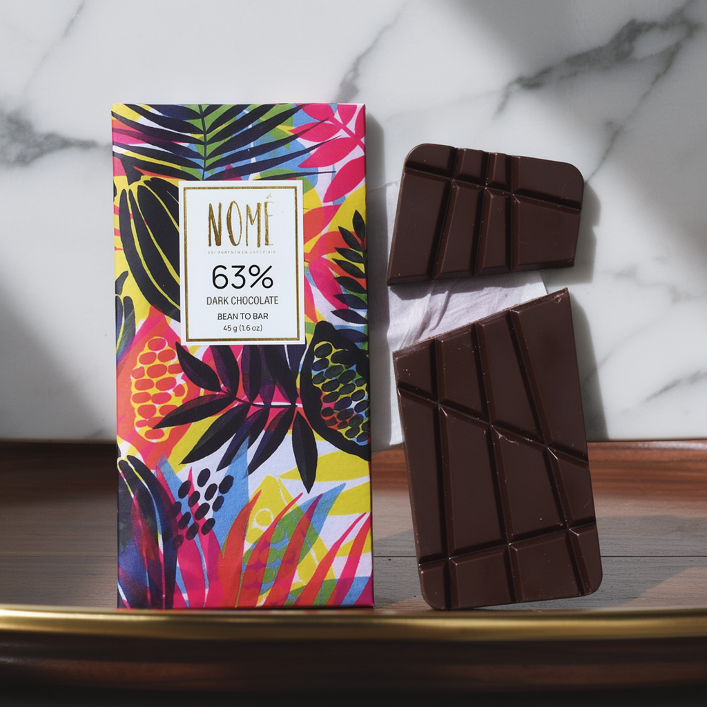 Nomé 63% Dark Chocolate bar unwrapped on white marble surface, single-origin Panama, vegan dairy-free, bean-to-bar