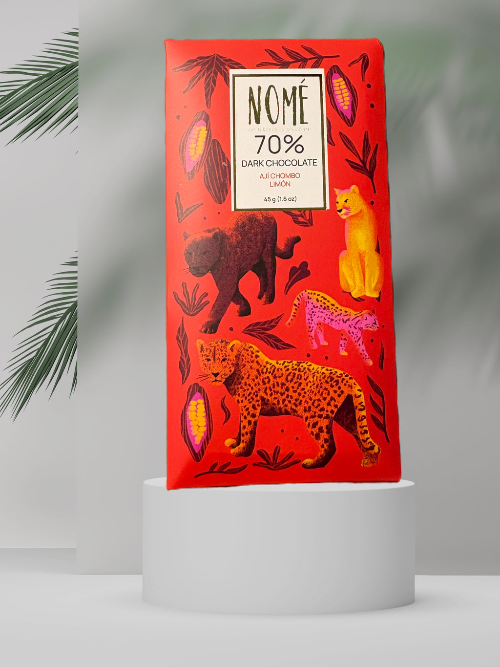 Nomé 70% Dark Chocolate Aji Chombo Limón bar packaging with vivid red big cat illustration on white background, single-origin Panama, vegan, 45g
