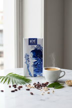 Nomé 73% Chocolate Oscuro bar packaging in bright natural light lifestyle setting, single-origin Panama, vegan dairy-free, bean-to-bar