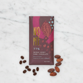 Nomé 77% Geisha Honey Process Dark Chocolate bar on white marble with roasted Geisha coffee beans and raw cacao beans, honey-processed single-origin Panama, dairy-free, 45g