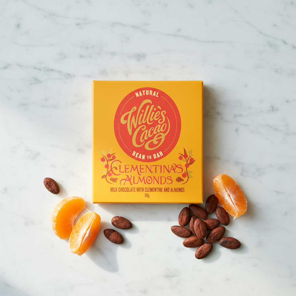 Willie's Cacao Clementina's Almonds 44% Milk Chocolate yellow box on white marble with fresh clementine slices and whole almonds, soft honeyed clementine and almonds, natural bean-to-bar, 50g