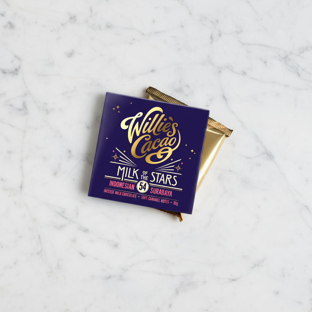 Willie's Cacao Milk of the Stars 54% Milk Chocolate packaging and wrapped bar on marble background