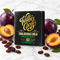 Chulucanas 70% dark chocolate bar on white marble with raisins and plums