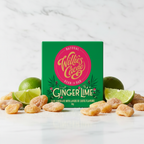 Willie's Cacao 70% Ginger Lime Dark Chocolate bar in green packaging on white marble, styled with candied ginger pieces and lime slices