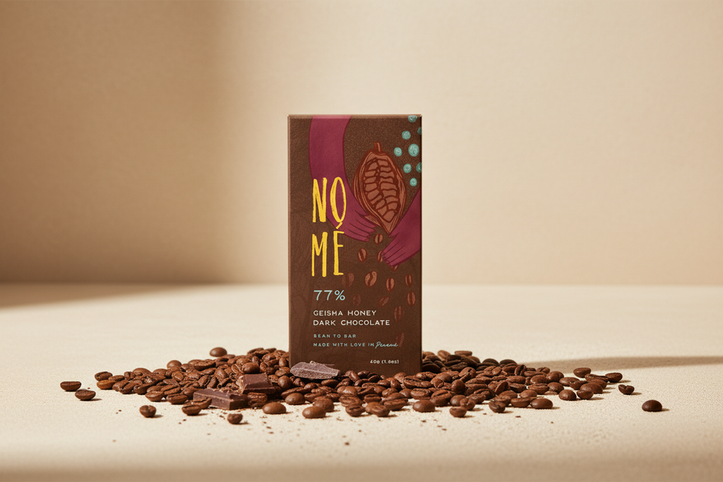 Nomé 77% Geisha Honey Process Dark Chocolate bar surrounded by roasted Geisha coffee beans on a warm cream surface